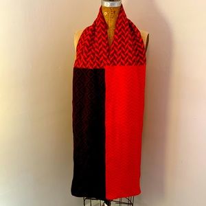 Mixed pattern knit scarf in vibrant shades of orange, hot pink, black & wine.